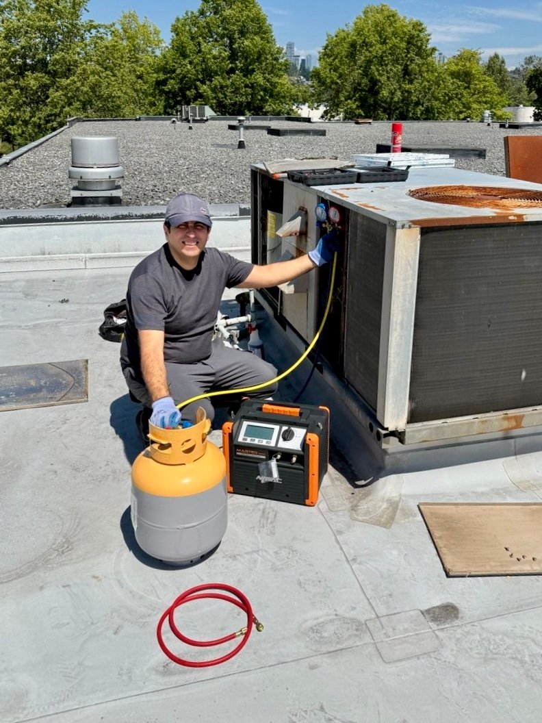 Commercial refrigeration technician servicing restaurant equipment in Metro Vancouver